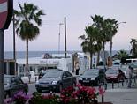 Cars on the promenade just before sunset in Paphos.s