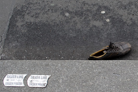 Shoe in a gutter in Prague