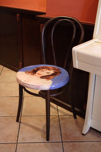 Chair with a woman's portrait