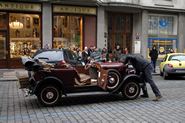 Vintage car being started
