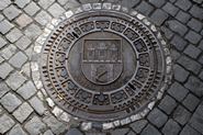 Manhole cover with coat of arms