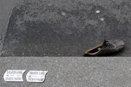 Abandoned shoe in gutter