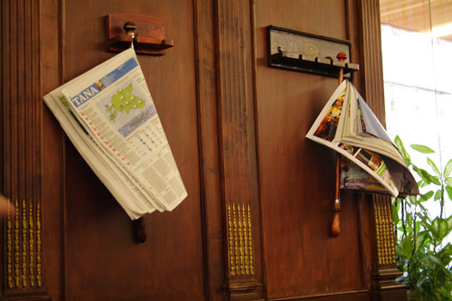 Papers on the wall in a patisserie in Tallinn